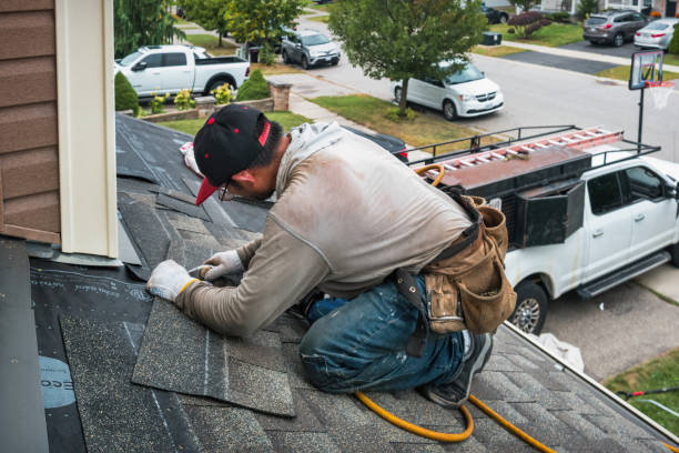 Professional Roofing technician working in State Farm, VA